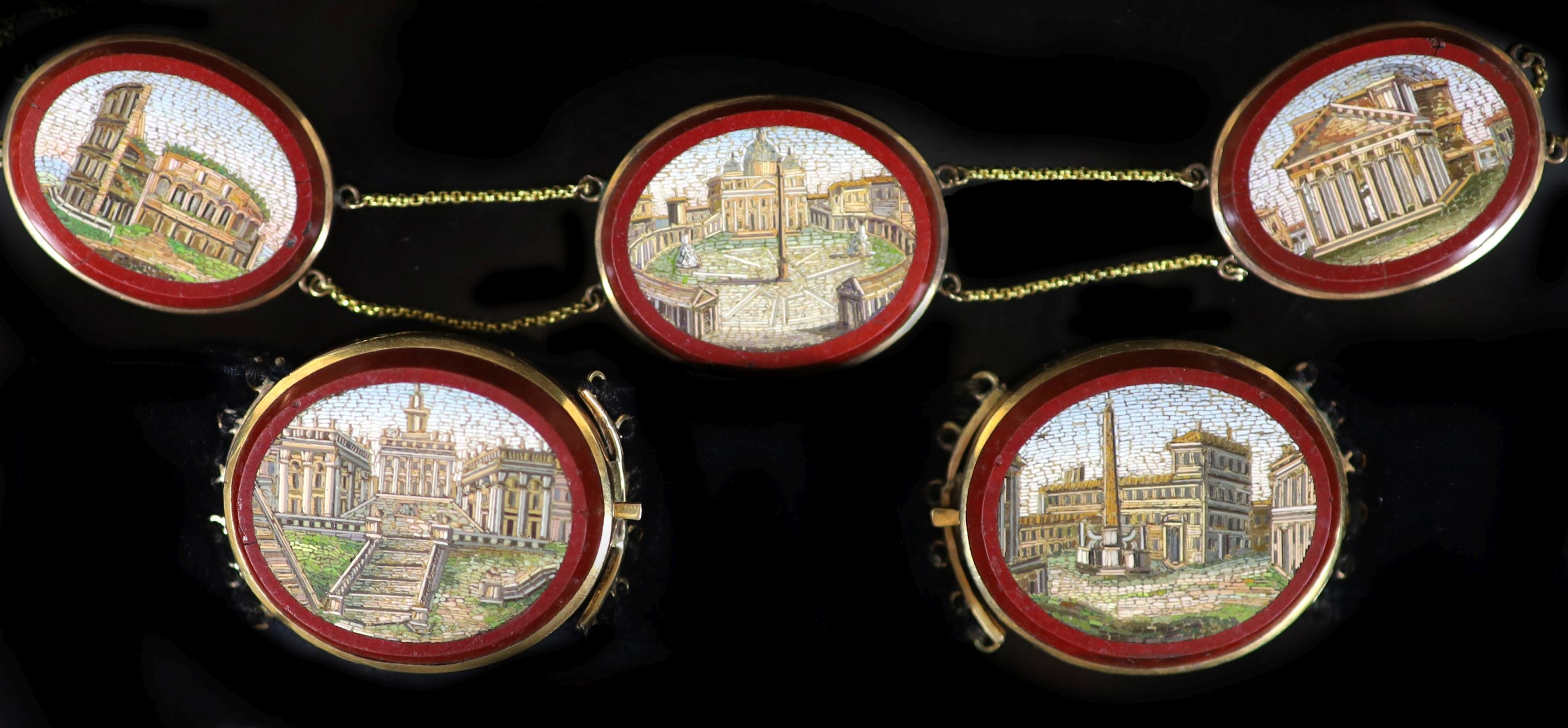 A 19th century Italian Grand Tour Souvenir gold mounted micro mosaic plaque necklace and a pair of matching bracelets Plaques 2cm-3cm., overall 42.5cm.